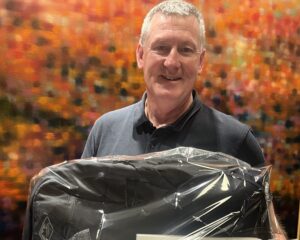 David Davine holding his Navy Health Avalon Prize
